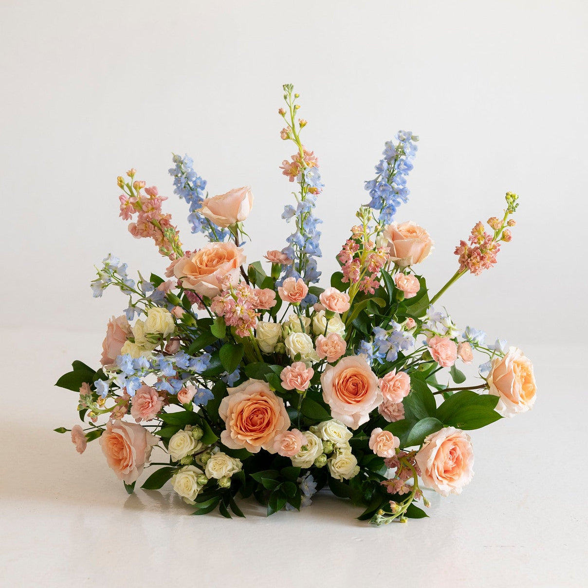 Peach and Blue Grounded Ceremony Arrangement