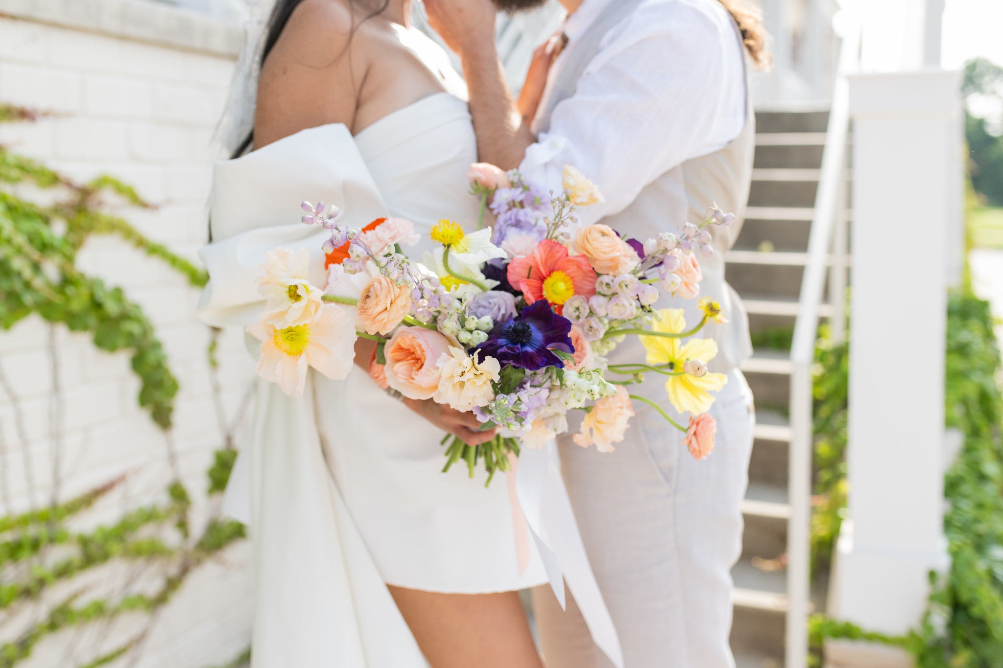 Bridal bouquet with poppies, Ranunculus, Anemones, Delphiniums and other flowers