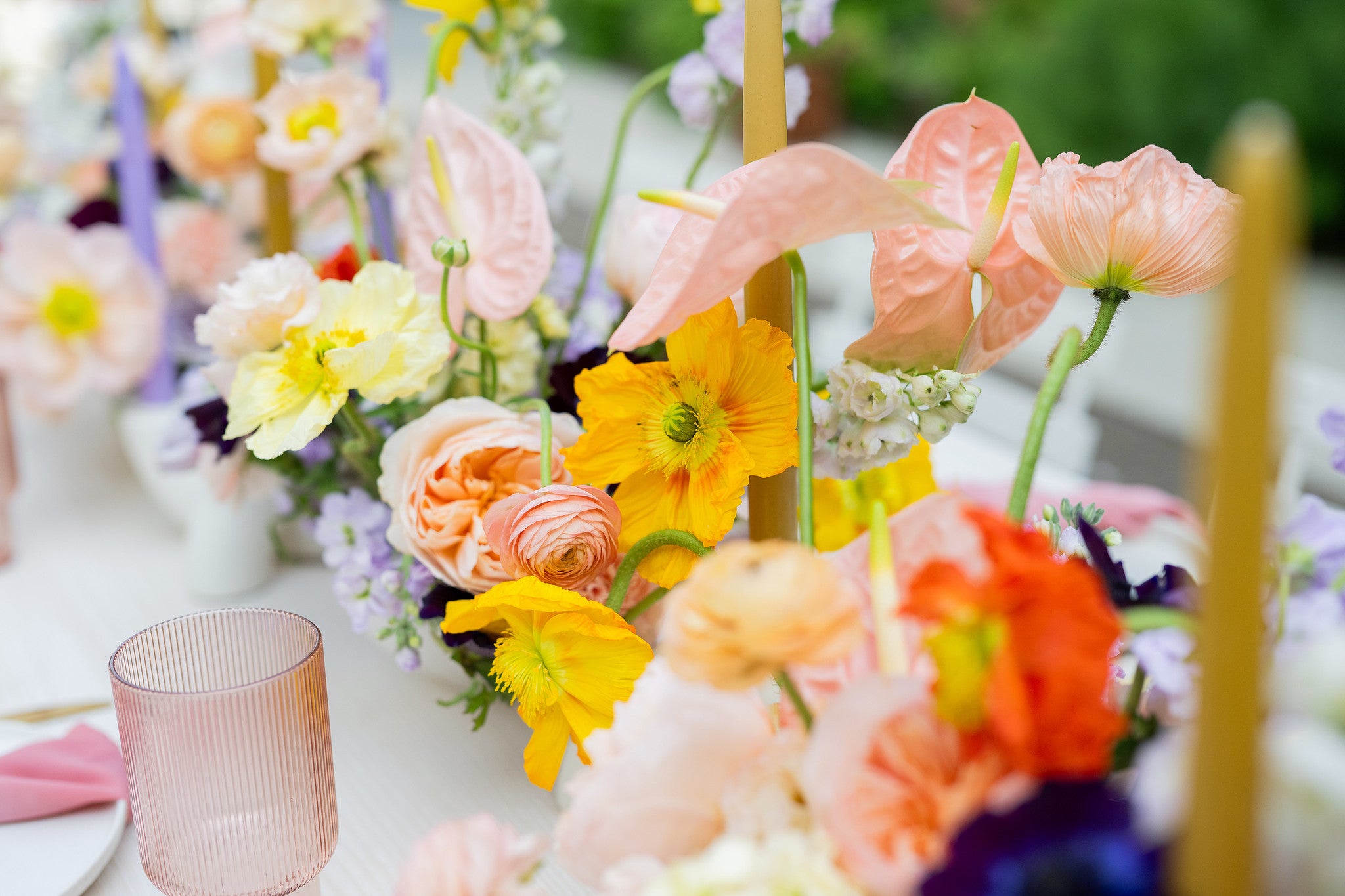 Centerpieces with Anthuriums, Poppies, Ranunculus, Garden Roses, and others