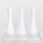 white plastic bud vase