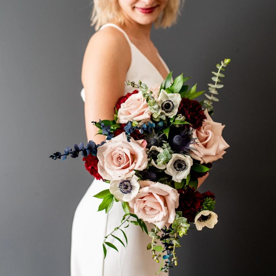 Navy and burgundy marsala bridal bouquet with anemones and thistle